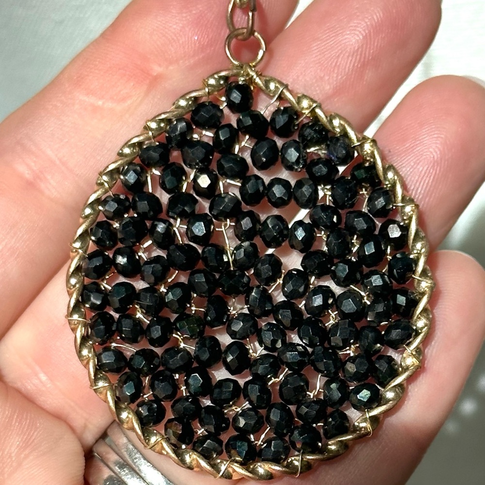 Pretty black long pendant necklace.
